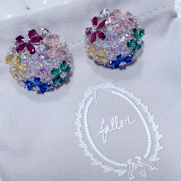 Lovely dome shaped earrings with multi colored glittering cubic zirconia stones.